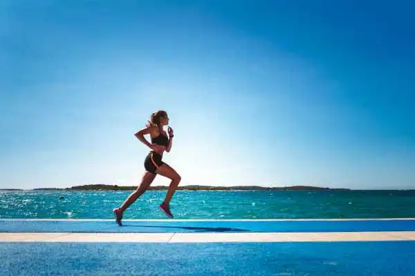 Woman running showing strong leg muscle Newbury